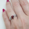 sterling silver ring with garnet trillion cut gemstone
