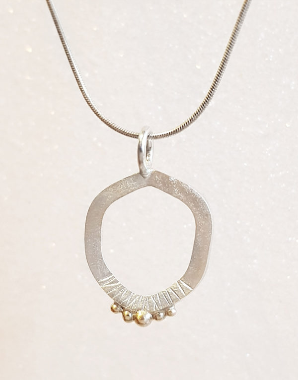 minimalist asymmetrical silver pendant for woman