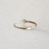 delicate engagement ring with diamond