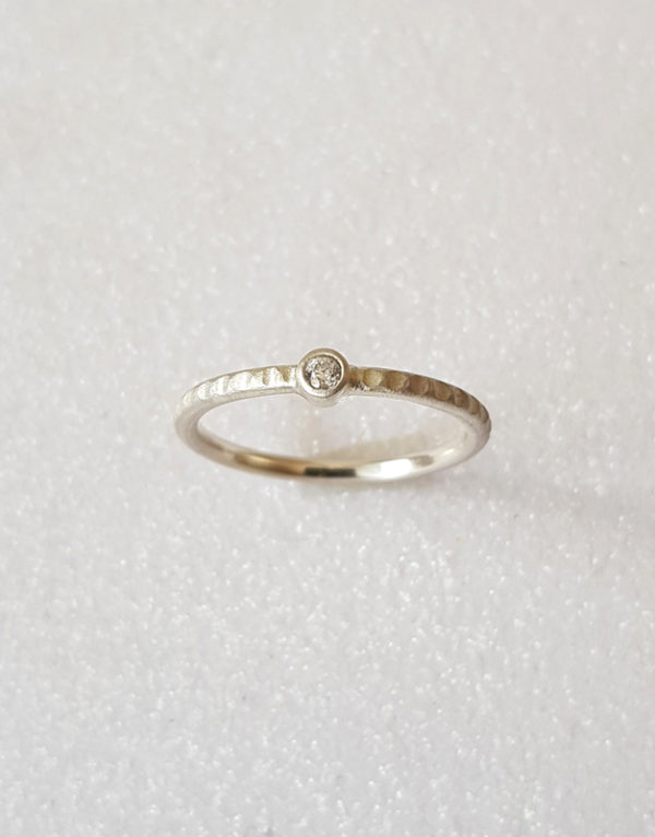 delicate engagement ring with diamond