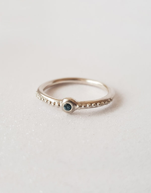 silver ring with topaz