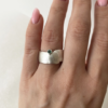 wide silver ring with emerald